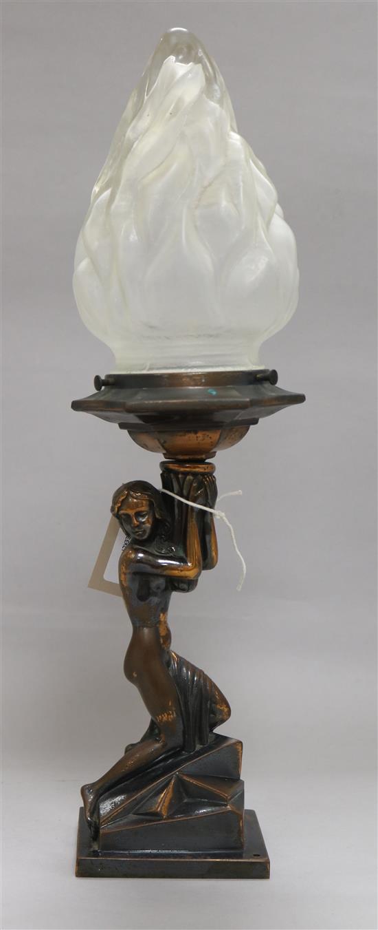 A bronze figural lamp with flambeau glass shade, H approx 43cm